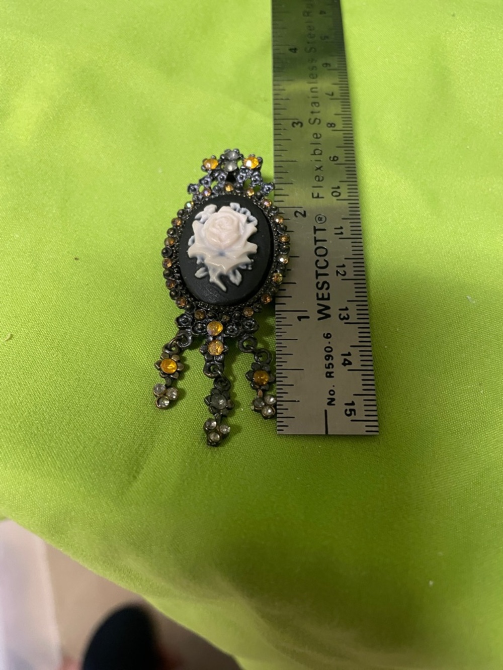 Vintage-Inspired Black Cameo Rose Pendant with Gold and Yellow Accents